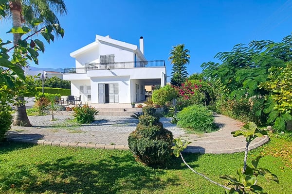 A peaceful retreat – this villa blends Mediterranean charm with serene coastal living. Spacious interiors and lush outdoor spaces await.