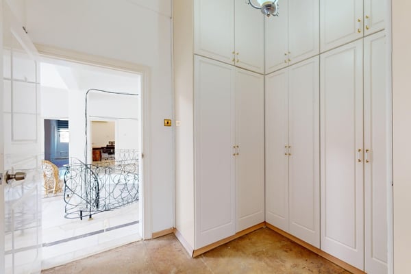 Step into a spa-like bathroom, where sleek fixtures, white ceramic tiles, and a minimalist design create a tranquil oasis.