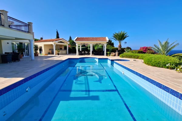 Centered pool-to-house axis captures symmetry, pergolas, and arches, reflecting the villa’s elegant and structured design.