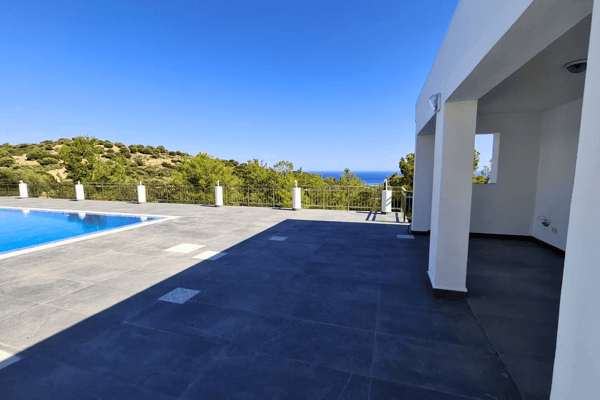 Concrete and tiled patio area with expansive views.