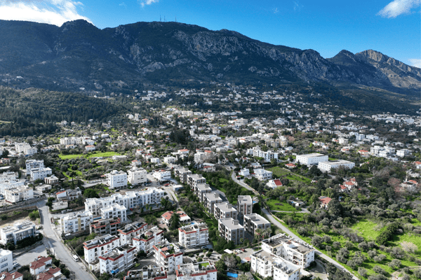 Image showcasing the terraced elevation and lush backdrop, adding dimension and privacy to the development's location.