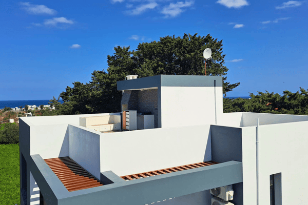 Upper terrace space with privacy walls and scenic views over the surrounding landscape.