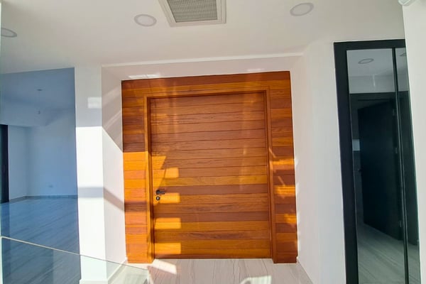 Entrance hall showcasing stylish reflective surfaces and a sleek, modern design ideal for creating a strong first impression.
