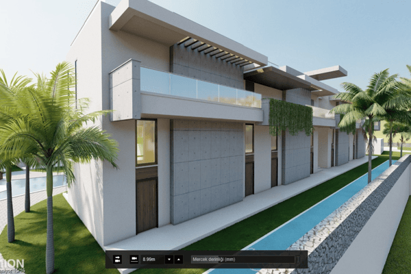 Side angle of minimalist building with a long pool running adjacent, framed by structured landscaping and open skies.