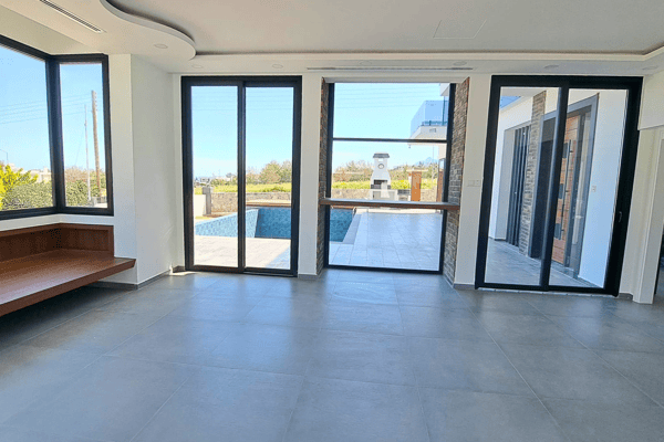 Main sitting room with full sliding doors to patio, offering open, airy transitions.
