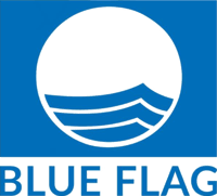 Illustration of a pristine Blue Flag-certified beach in Cyprus, symbolizing environmental excellence, high water quality, and sustainable coastal tourism. The visual emphasizes North Cyprus' dedication to clean and well-maintained beaches, meeting international environmental standards.
