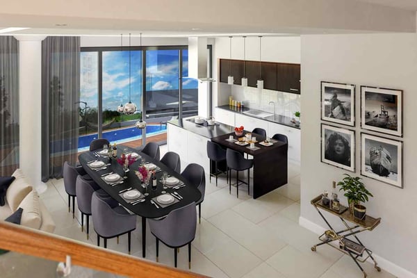High-end dining and kitchen area with a modern open-plan design and stylish pendant lights
