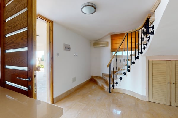 Large wardrobe space with built-in wooden cabinets and an organized storage system, perfect for keeping clothes and accessories neatly arranged.