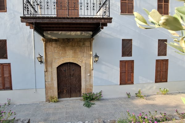 Old Stone Water Fountain in a Courtyard – A historical stone fountain with intricate carvings.