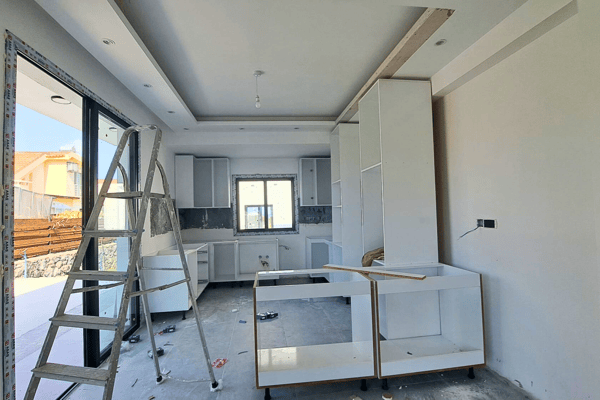 Dedicated laundry or utility room with shelving and plumbing installations.