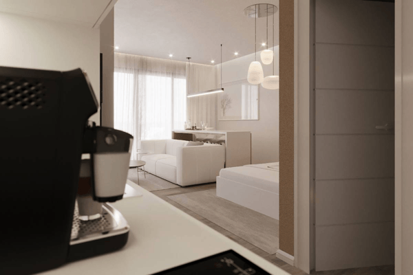 Sleek and functional modern apartment bathroom featuring a walk-in shower with glass screen, contemporary wall-mounted fixtures, and vanity unit.
