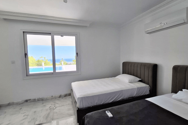 Smaller bedroom with a single bed and simple furnishings.