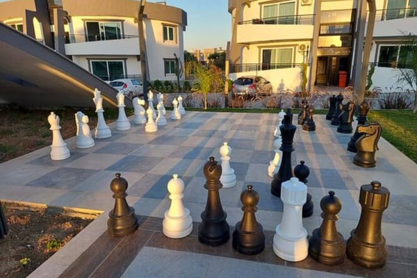 Vibrant community setting with residents enjoying the shared outdoor spaces and amenities.