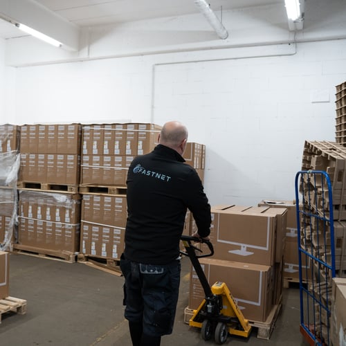 Technicians perform rack moves, cabling, and server commissioning in enterprise data centers