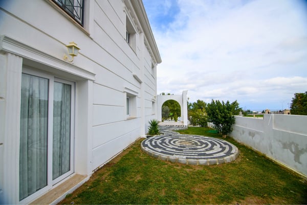 Ground floor terrace seamlessly connects indoor spaces to lush outdoor areas for relaxed garden living.