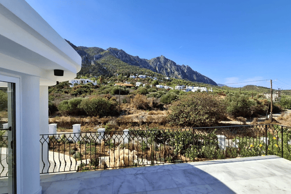 View from upper terrace showing scenic hills and rooftops.