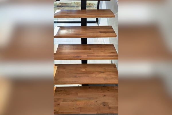 Interior staircase in modern design, maximizing light flow and offering a sculptural, stylish centerpiece.