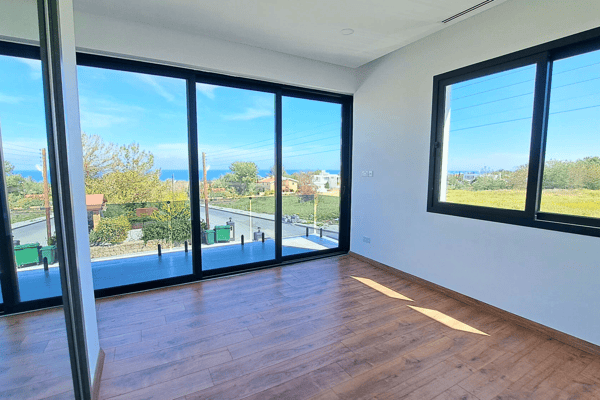 Living area with dual-aspect glazing, providing abundant natural light and views.