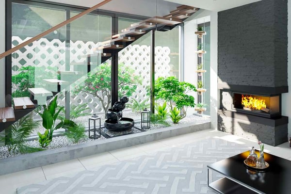 Well-lit interior with a staircase, fireplace, and an abundance of greenery, featuring a modern aesthetic