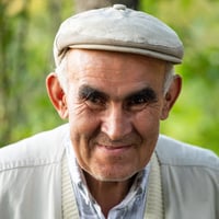 Illustration of Mohammed, a retired executive from Istanbul, exploring historic sites and engaging in local traditions in North Cyprus. The visual highlights a balanced lifestyle with modern comforts, cultural heritage, and a strong expat network that keeps him connected to his Turkish roots.