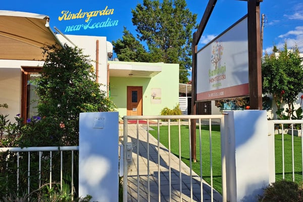 Suburban neighborhood view highlighting nearby amenities and a kindergarten, ideal for family-friendly modern living.
