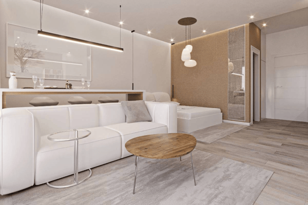 Comfortable apartment bedroom setting featuring minimalist modern furniture, simple window treatments, and a calm, neutral color palette throughout.