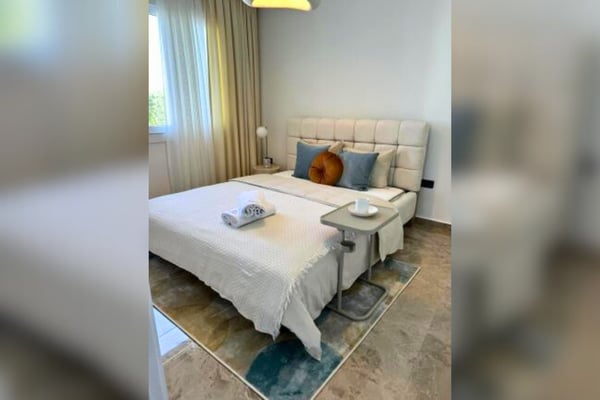 Alternate angle of sleeping space with ambient lighting and clean lines, offering comfort within a modern layout.