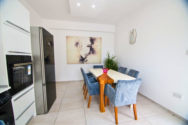 Charming breakfast nook with minimalist decor and soft light, creating a serene space to start the day.