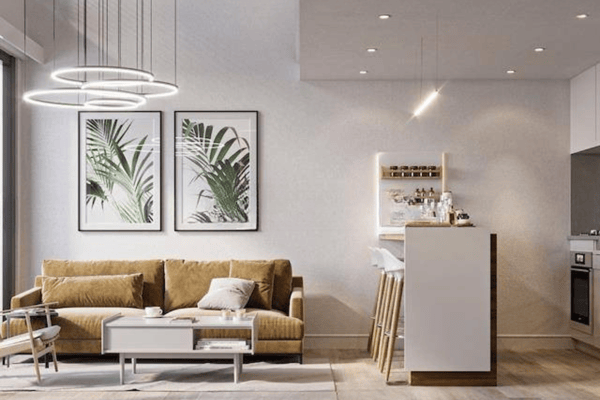 Alternate view of living space highlighting refined wall decor, clean lines, and thoughtfully placed artwork.