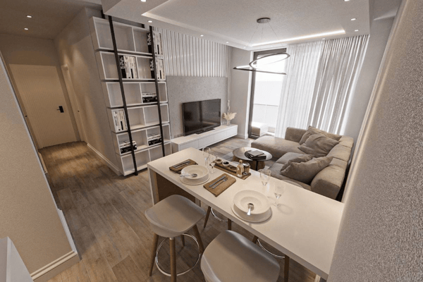 Modern apartment living room designed for comfort. Features a plush grey sofa, tasteful decor, media console, and large sliding doors inviting light.