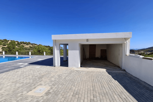 Driveway or entrance from the interior yard toward a garage or storage area.