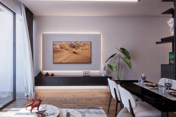 Bright interior living and dining area with contemporary decor and large windows connecting indoor comfort with natural light.