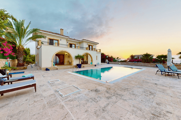 Generous patio space with panoramic sea views and surrounding palms, enhancing the tropical resort feel.