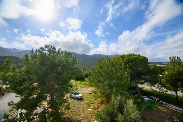 Sweeping views of surrounding greenery and tranquil terrain reflecting the villa’s scenic, private setting.