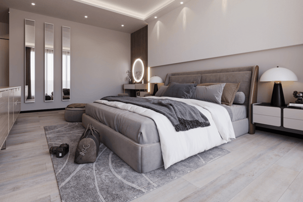 Modern suite with layered textures, soft lighting and wall-mounted screen blends comfort and elegance in a restful design.