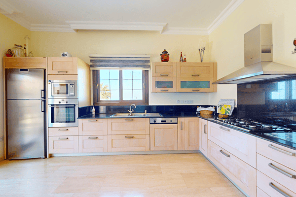 Another kitchen view showcasing functionality and natural light, perfect for family cooking.