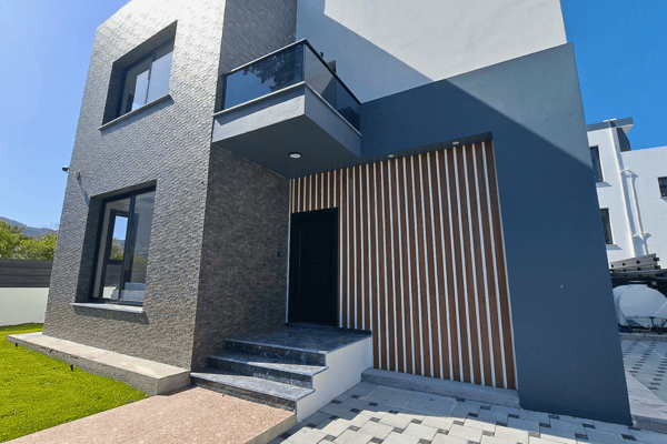 Side perspective highlighting the elegant contrast of white and dark gray exterior materials.