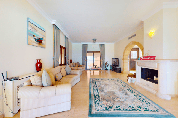 Alternate angle of the living room emphasizing openness and symmetry.