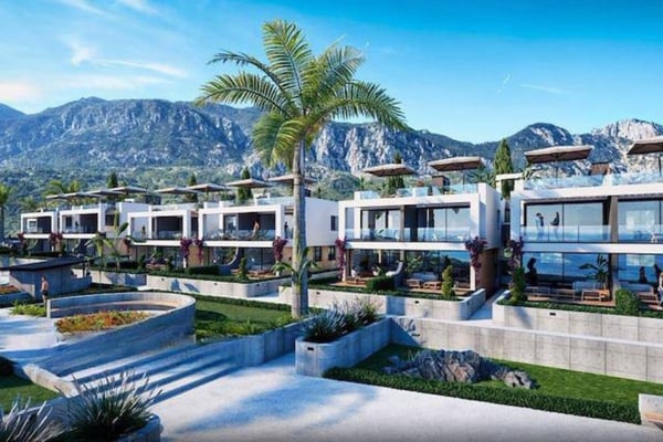 Contemporary ground-floor apartment featuring private garden, mountain views, and access to shared amenities in a gated community.