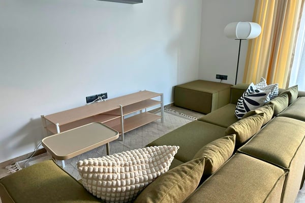 Open-concept transition between living and kitchen spaces, showcasing flow and balance in a thoughtfully designed layout.