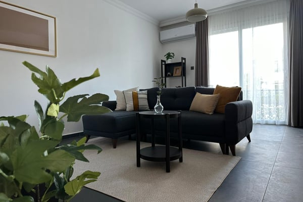 The seamless blend of the living and dining areas creates a welcoming space for both relaxation and entertaining.