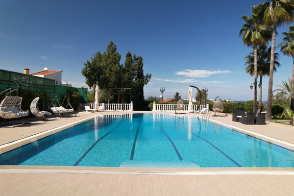 A picture-perfect poolside haven, where the curved architecture of this luxury villa blends seamlessly with the natural beauty of North Cyprus.