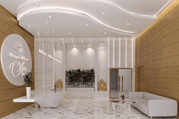 Relaxation area with ambient lighting, plush seating, and curved modern ceiling—offering a tranquil wellness escape.