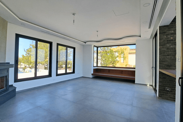 Living room with sliding doors that open to the garden, blending interior and exterior spaces.