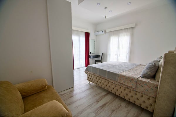Master bedroom suite with sophisticated tones and spacious layout promoting luxurious rest.