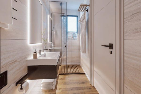 Double closet doors with flush, handle-free design that complements the home’s minimalist architectural theme.
