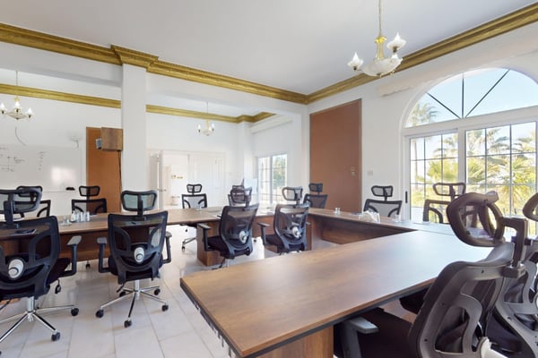Step into a cozy yet spacious lounge area, where soft lighting and comfortable furnishings invite you to relax.