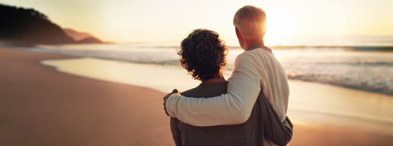 Happy retirees in North Cyprus relaxing in a quiet, scenic coastal town, highlighting the region’s stable socio-political environment and low crime rates for a worry-free retirement.