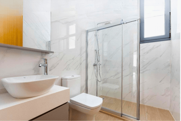 Spa-inspired bathroom with glass shower and floating vanity, designed for a modern, calming daily experience.