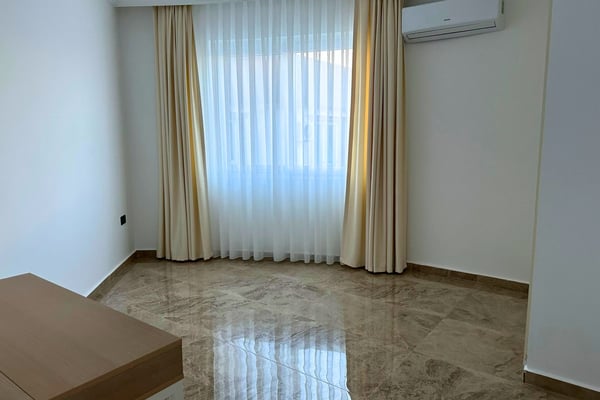 Serene bedroom with soft linens and sheer curtains, enhanced by bright lighting and a peaceful, uncluttered aesthetic.